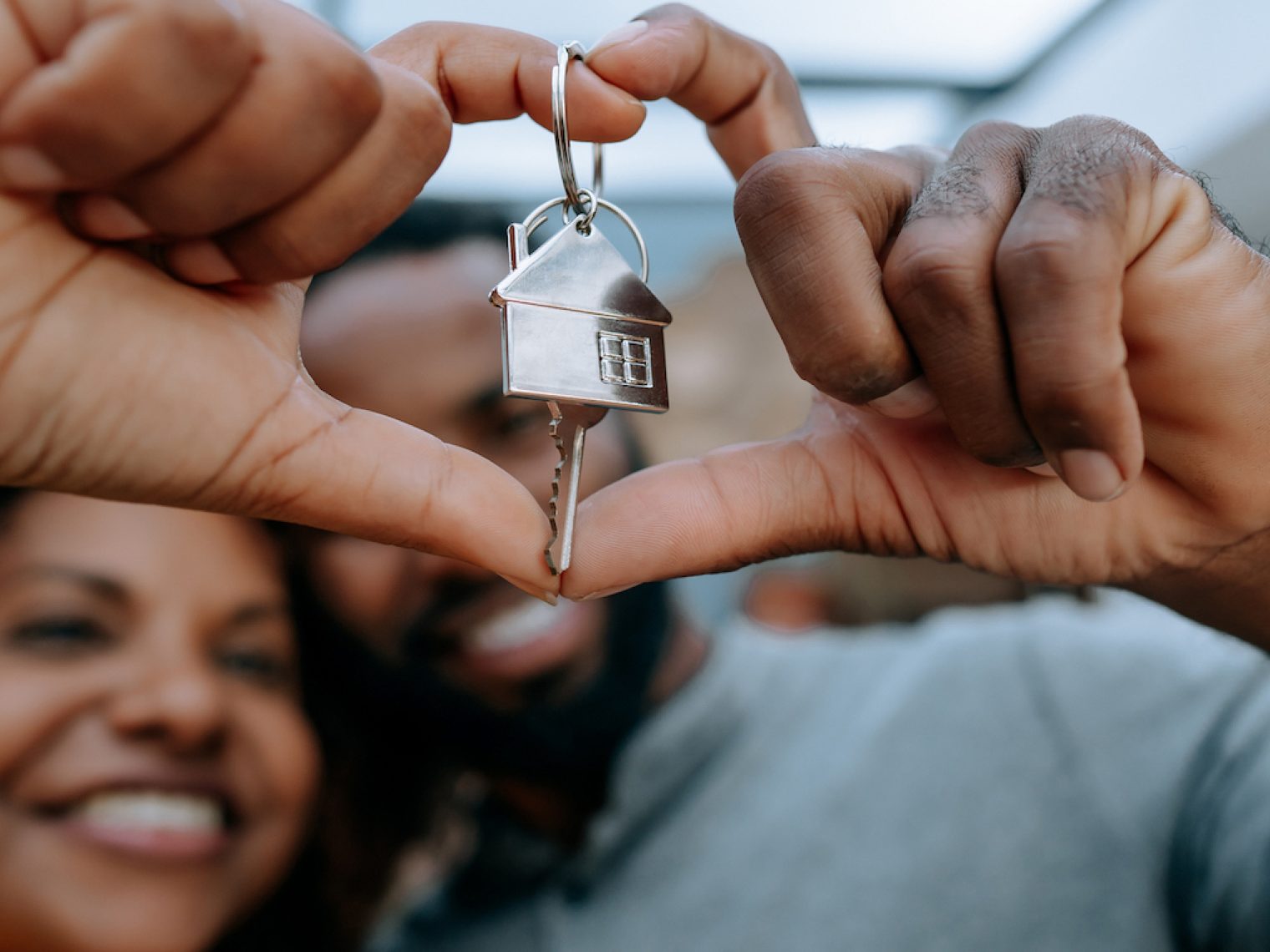 Happy couple receiving key to their second home bought with a VA loan.