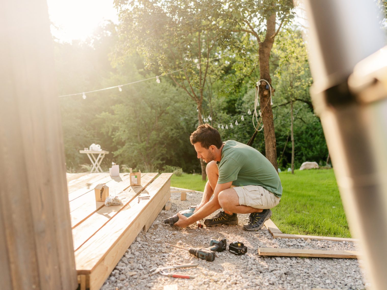 Man installing a deck for his home.